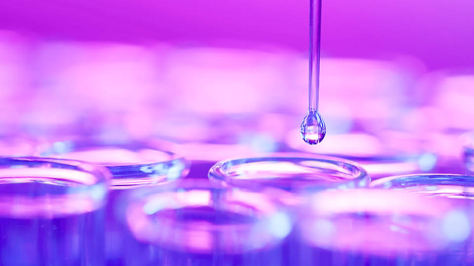 1410329966 dripped, chemical dropper close up of science lab research test tube - pipette dripping droplets to dropper surrounded by neon reflection